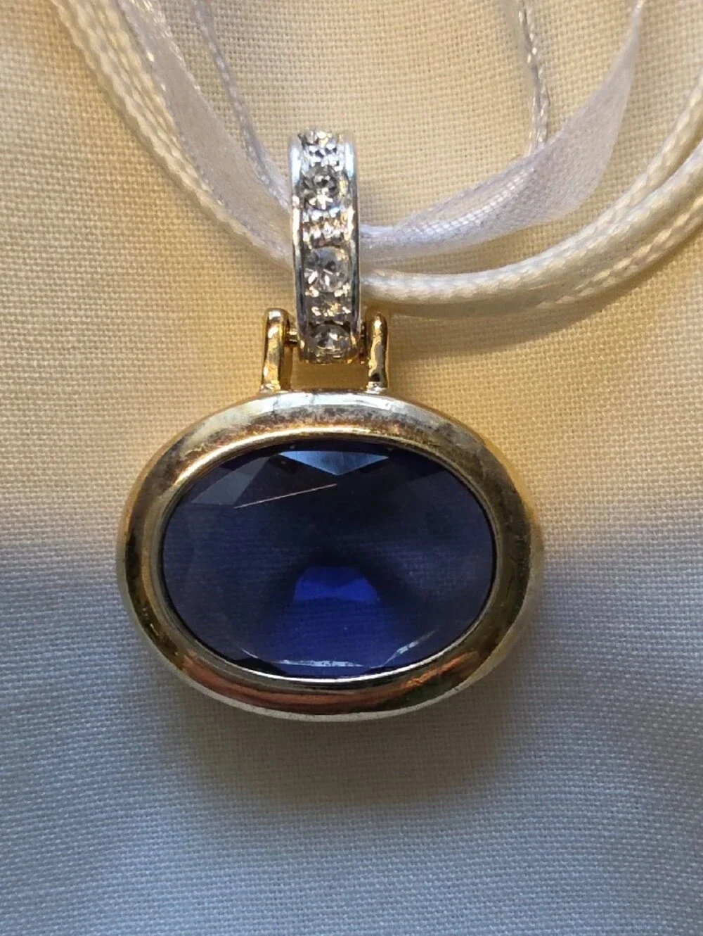 Silver Ribbon Necklace with Deep Blue Oval Gem Pendant